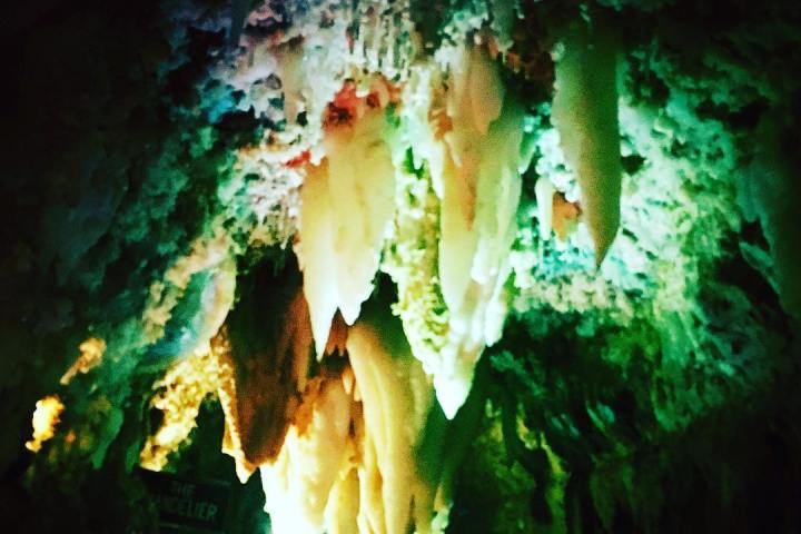 Colorful cave ceiling with stalactites and glowing lights